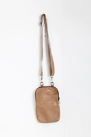 Brown leather crossbody bag on a white background, Obroi