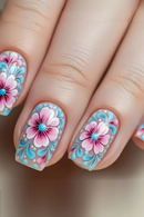 Nails with floral design featuring pink flowers and blue accents on a neutral background, Obroi
