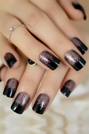 Close-up of a hand with black and metallic glittery nail polish on a blurred background, Obroi