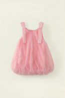 A pink toddler girl's tulle dress with shoulder straps, featuring a sparkly glitter finish and a voluminous gathered skirt, laid flat against a light cream background, Obroi