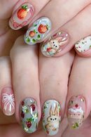 Nails with cute designs including bunnies, strawberries, and flowers, Obroi