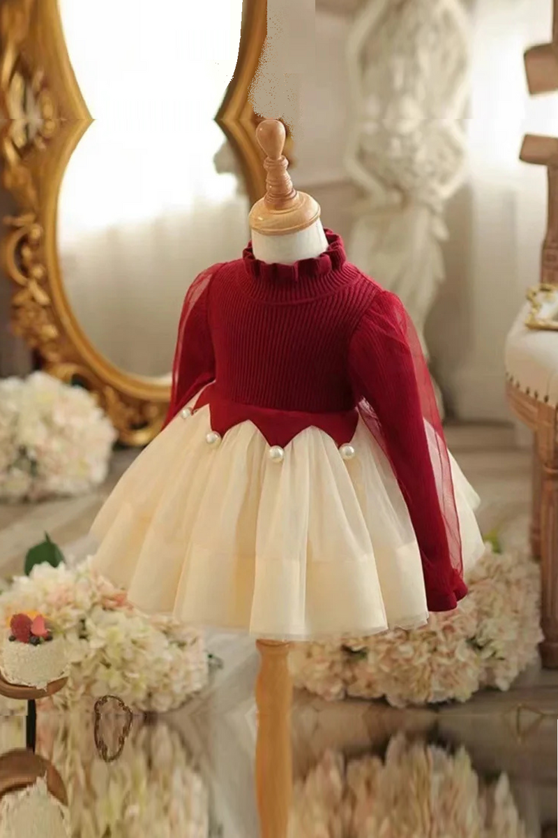 Mannequin wearing a red sweater and white skirt , Obroi