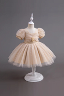 Beige dress on a mannequin against a gray background, Obroi