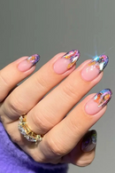Hand with colorful nail art on a gray background, Obroi