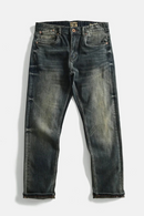Pair of distressed blue jeans on a white background, Obroi