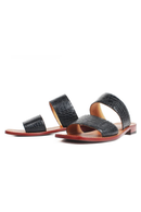Black sandals with brown soles on a white background, Obroi