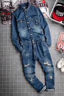 Denim jumpsuit on a tiled floor with magazines in the background, Obroi
