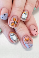 Nails with cute designs of ghosts, flowers, and mushrooms on a light background, Obroi