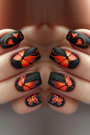Nails with black and orange butterfly design on a neutral background, Obroi