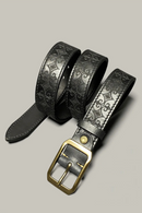 Black leather belt with gold buckle on a gray background, Obroi