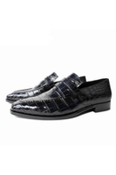 Black crocodile-patterned loafers on a white background, Obroi