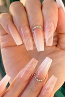 Hand with long, pink gradient nails and a ring on each finger, Obroi