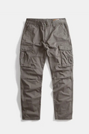 A pair of dark gray cargo pants with multiple utility pockets, laid flat against a light gray background, Obroi