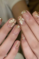Nails with gold leaf design on a neutral background, Obroi