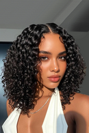 Woman with curly hair wearing a white top against a neutral background, Obroi