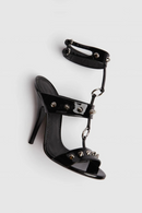 Black high-heeled sandal with studded details on a white background, Obroi