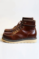 Brown leather boots with beige soles on a white background, Obroi