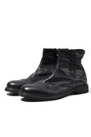 Pair of black leather boots on a white background, Obroi