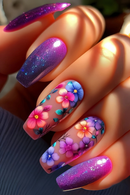 Colorful floral nail art on a hand with a blurred background, Obroi