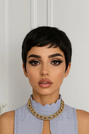 Woman wearing a gold necklace against a white background, Obroi