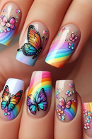 Nails with colorful butterfly and rainbow designs on a neutral background, Obroi