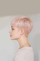 Person with short pink hair against a plain background, Obroi