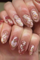 Close-up of hands with pink and gold nail art, Obroi