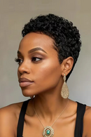 Woman with styled short hair wearing earrings and a necklace against a neutral background, Obroi
