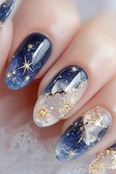 Nail art with blue, white, and gold design on a neutral background, Obroi