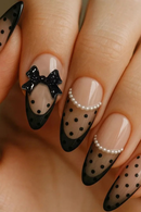 Nails with black polka dots and decorative elements on a neutral background, Obroi