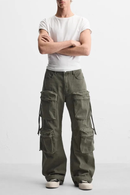 Person wearing a white t-shirt and green cargo pants on a white background, Obroi