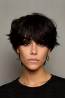 Woman with short dark hair wearing gold earrings against a gray background, Obroi